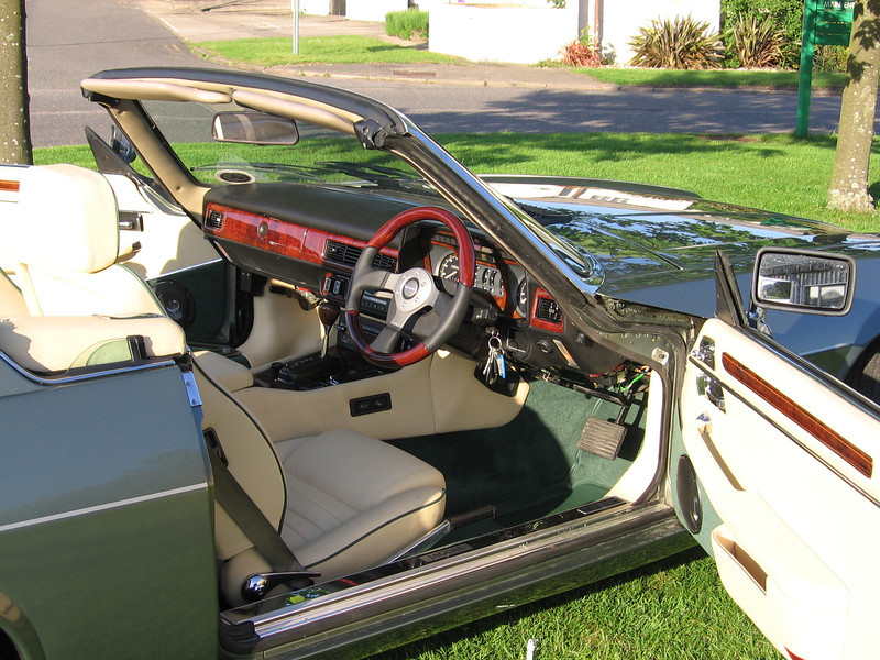 Magnolia leather, piped green; green wool carpet, eadged in green leather; American burr walnut woods